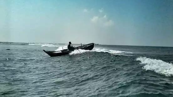 Fisherman rowing at Agatti, Lakshadweep